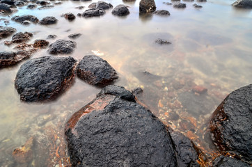 Black stone on the beach