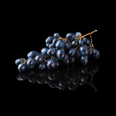 Bunch of blue grapes isolated on black - 123815784