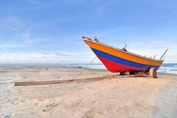 Naklejka na ściany i meble Boat on the beach