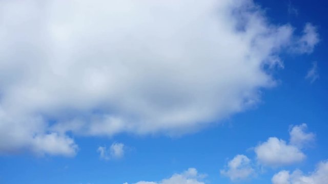 Clouds in the blue sky above the city. Timelapse.