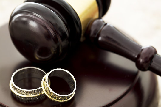 Family law concept, gavel and rings 