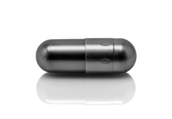 black pill capsule isolated on white background