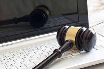 Obraz na płótnie Canvas Law concept. Close up of judge gavel and laptop