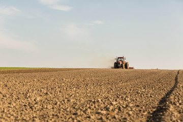 Fototapeta premium Close up shot of seedbed cultivator machine at work