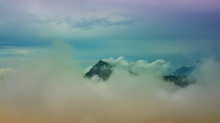 Naklejka na ściany i meble Beautiful landscape with Kitzbuhel mountain peak in the mist, Tirol, Austria