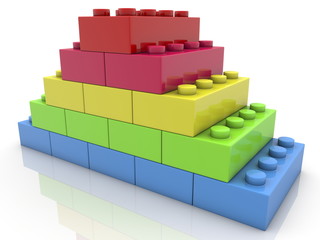 Pyramid of toy bricks on white