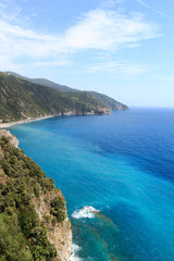 Fototapeta na wymiar Rocky coast and Cinque Terre village Manarola and Mediterranean Sea, Italy