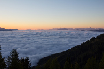 Early Morning Sunrise Panorama View On The Way To Gmeineck 2.592m With CLouds Above The Valley in Autumn In Carinthia Austria