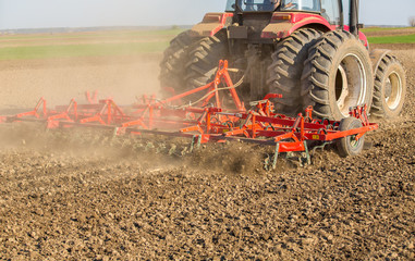 Close up shot of seedbed cultivator machine at work
