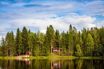 Foto op Canvas Red wooden cottage by the lake © nblxer