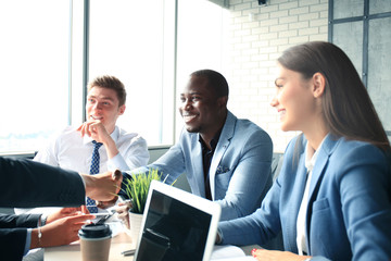 Business people shaking hands, finishing up a meeting
