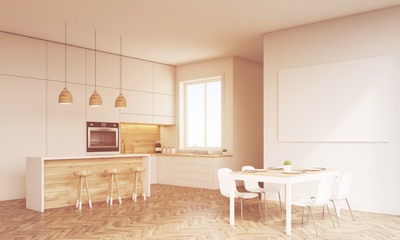 Side view of sunlit kitchen with oven and window