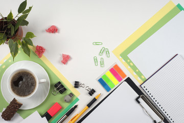 Business blank, notepad, coffee cup and pen at office desk table top view. Corporate stationery branding mock-up