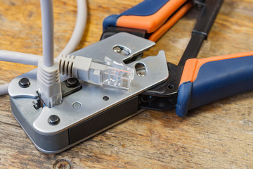 Crimping tool for mounting of the connectors RJ45 on the desktop in a workshop