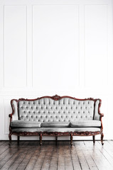 Ancient sofa in a retro interior. Vintage background