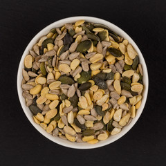 mixed seeds in wooden bowl