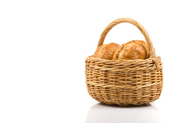 Fototapeta na wymiar bread in wicker basket isolated on white