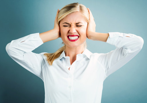 Young Woman Blocking Her Ears