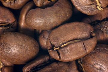 Coffee beans closeup on natural texture. 
