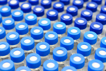 Rows of glass vials in the tray automatic liquid dispenser.