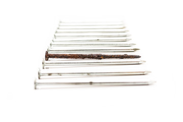 Old rusty nail and new ones