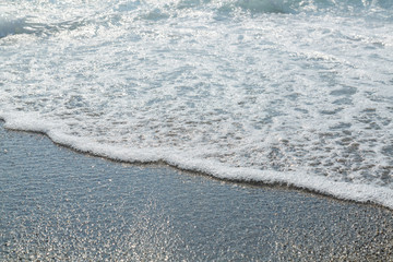 sea tide foam on the pebbles