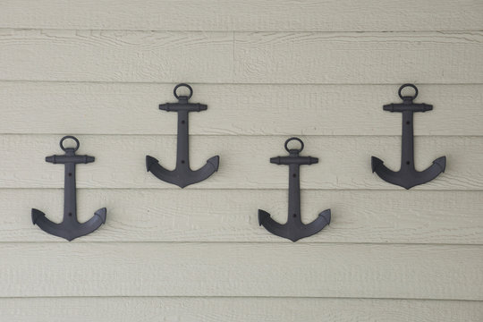 Four brown anchors cast iron wall decoration