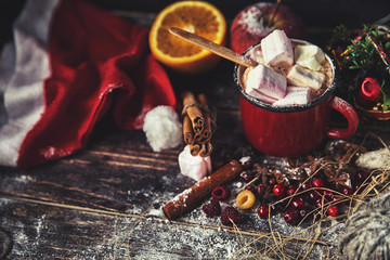 Red mug with hot chocolate with melted marshmallow