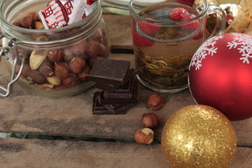 Christmas tea party. tea with raspberry, honey, nuts and chocolate