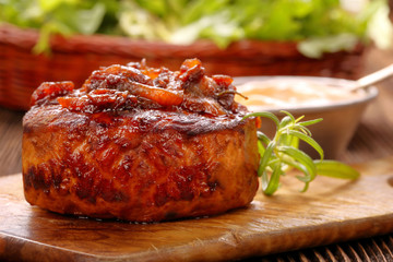 Smoky grilled hot chop on wooden background