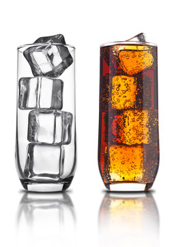 Glass of cola with ice cubes and empty glass