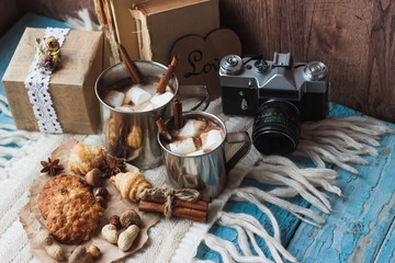 Metal mugs with cacao and marshmallow
