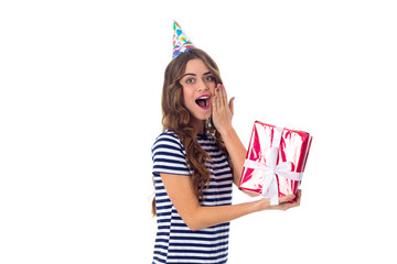 Woman in celebration cap holding a present 