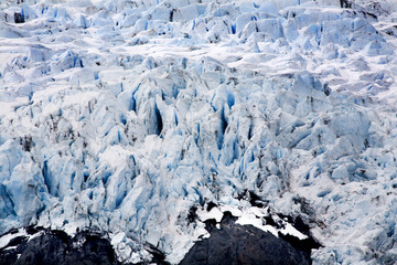 Blue Icy Portage Glacier with Rock and Crevaces Alaska