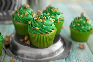 Pistachio cupcakes on metal plate