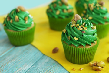 Pistachio cupcakes on yellow napkin