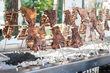 Traditional Argentinian asado roasted lamb grilled meat.