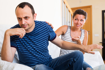 Sad partner asking for forgiveness