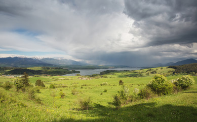 Obraz premium Sunny cloudy day in mountains