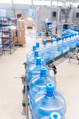 Water factory - Water bottling line for processing and bottling pure spring water into gallons.