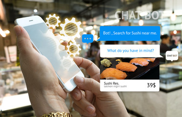 Chat bot and future marketing concept . Customer hand holding smart phone for order sushi and popup out tablet screen with automatic chatbot message screen , Department store background