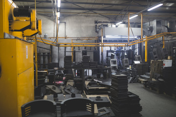 Metallurgy industry interiors. Details from factory for production of heavy pellet stoves and boilers. Sector for painting.