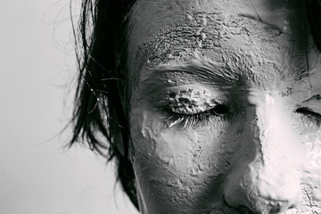 Woman face with cracked skin