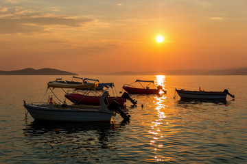 Traditional thai boats at sunset beach