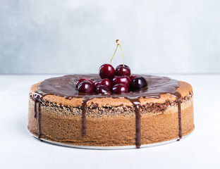 Chocolate cake with juicy cherries