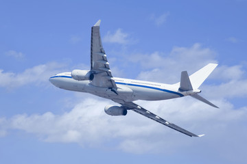 Twin-engine airliner climbing upwards.
