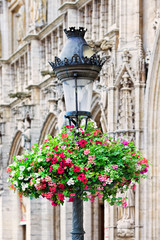 Fototapeta na wymiar Vintage lantern with a fresh flower bouquet; Brussels, Belgium