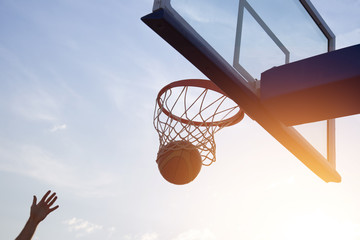 Fototapeta premium Basketball going through the basket