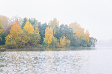 Fog on the lake Senezh in Solnechnogorsk fall in calm weather. Autumn water landscape