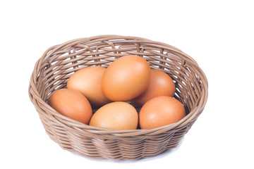 egg in basket wicker on white background
